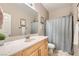 Bright bathroom with shower and sink with lots of storage space and natural light at 7497 Alamo Ranch Ave, Las Vegas, NV 89179