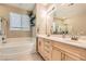 Bathroom with tile flooring and double sink vanity with lots of space and natural light at 7497 Alamo Ranch Ave, Las Vegas, NV 89179