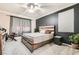 Bedroom with modern ceiling fan, plank wall and minimalist decor at 7497 Alamo Ranch Ave, Las Vegas, NV 89179