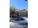 Charming single-story home with a two-car garage and desert landscaping in the front yard at 7497 Alamo Ranch Ave, Las Vegas, NV 89179