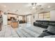 Open-concept living space featuring a modern kitchen, dining area, and comfortable living room at 7497 Alamo Ranch Ave, Las Vegas, NV 89179