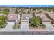 Beautiful single-Gathering home with well-maintained landscaping, a two-car garage, and a tile roof at 7624 Fruit Dove St, North Las Vegas, NV 89084