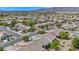 Expansive neighborhood with tree-lined streets, well-maintained homes, and scenic views at 7624 Fruit Dove St, North Las Vegas, NV 89084