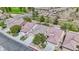 Beautiful single-Gathering home with well-maintained landscaping, a two-car garage, and a tile roof at 7624 Fruit Dove St, North Las Vegas, NV 89084