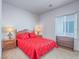 Cozy bedroom featuring a wooden bed frame, matching nightstands, and soft, natural lighting at 7624 Fruit Dove St, North Las Vegas, NV 89084