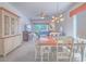 Inviting dining area featuring a classic china cabinet, table setting and view to the living room at 7624 Fruit Dove St, North Las Vegas, NV 89084