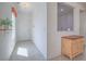 Bright entryway features tile flooring, neutral paint, and decorative plant shelf near the front door at 7624 Fruit Dove St, North Las Vegas, NV 89084