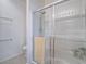 Clean shower with glass enclosure, complemented by neutral tiles and a refreshing shower head at 7624 Fruit Dove St, North Las Vegas, NV 89084