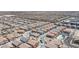 Wide aerial shot of a sprawling suburban development with numerous homes and community pool at 7890 Aurora Sky St # 1, North Las Vegas, NV 89084