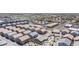Overhead shot of a residential area showcasing modern homes, parking areas, and a central green space with playground at 7890 Aurora Sky St # 1, North Las Vegas, NV 89084