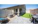 Well maintained backyard with lush artificial turf, brick patio and privacy fence at 7890 Aurora Sky St # 1, North Las Vegas, NV 89084