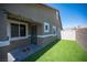 Cozy backyard patio and lush artificial turf with views of nearby mountains at 7890 Aurora Sky St # 1, North Las Vegas, NV 89084