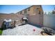 Relaxing backyard area featuring patio, barbecue, brick wall, and outdoor seating at 7890 Aurora Sky St # 1, North Las Vegas, NV 89084