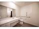 Accessible bathroom featuring white vanity, toilet, and hand rails at 7890 Aurora Sky St # 1, North Las Vegas, NV 89084