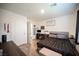 Bedroom featuring wood-look floors, neutral colors, and bright, natural light at 7890 Aurora Sky St # 1, North Las Vegas, NV 89084