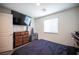Simple bedroom featuring tv and dresser at 7890 Aurora Sky St # 1, North Las Vegas, NV 89084