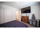 Modern bedroom features a large closet and television at 7890 Aurora Sky St # 1, North Las Vegas, NV 89084