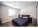 Cozy bedroom with a comfortable bed, large window, and modern decor at 7890 Aurora Sky St # 1, North Las Vegas, NV 89084