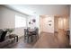 Charming dining area with a wooden table, seating for four, and stylish decor perfect for meals at 7890 Aurora Sky St # 1, North Las Vegas, NV 89084