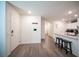 Welcoming foyer with modern finishes, leading to a stylish kitchen and living area perfect for first impressions at 7890 Aurora Sky St # 1, North Las Vegas, NV 89084