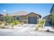 Charming single-story home featuring desert landscaping and a two-car garage at 7890 Aurora Sky St # 1, North Las Vegas, NV 89084