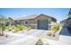 Charming single-story home featuring desert landscaping and a two-car garage at 7890 Aurora Sky St # 1, North Las Vegas, NV 89084