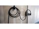 Close-up of the garage wall-mounted electric vehicle charger for convenient at-home charging at 7890 Aurora Sky St # 1, North Las Vegas, NV 89084