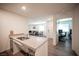 Kitchen island featuring a stainless steel sink and view into other room at 7890 Aurora Sky St # 1, North Las Vegas, NV 89084
