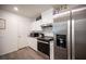 Efficient kitchen with stainless steel appliances, plenty of white cabinet space, and modern countertops at 7890 Aurora Sky St # 1, North Las Vegas, NV 89084