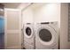 Convenient laundry room with modern side-by-side washer and dryer units for easy laundry days at 7890 Aurora Sky St # 1, North Las Vegas, NV 89084