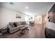 Spacious living room with contemporary decor, cozy seating, and a sleek entertainment center for modern comfort at 7890 Aurora Sky St # 1, North Las Vegas, NV 89084
