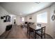 Inviting living room features a comfortable couch, dining area, and modern entertainment center for relaxation and enjoyment at 7890 Aurora Sky St # 1, North Las Vegas, NV 89084