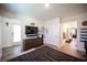 Spacious main bedroom showcasing wood-look floors and an open floor plan at 7890 Aurora Sky St # 1, North Las Vegas, NV 89084