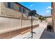 Large backyard featuring a grill, basketball hoops, and a privacy fence, creating a versatile outdoor space at 8059 Wards Ferry St, Las Vegas, NV 89139