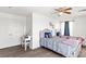 Bright bedroom with white walls, two beds, wood-look floors, and a ceiling fan for comfortable living at 8059 Wards Ferry St, Las Vegas, NV 89139