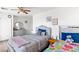 Cozy bedroom featuring two beds, light gray walls, and neutral-toned furniture perfect for a shared space at 8059 Wards Ferry St, Las Vegas, NV 89139