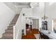 Bright open foyer with wood floors, a view of the living room, dining area, and second floor at 8059 Wards Ferry St, Las Vegas, NV 89139