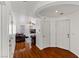 Welcoming entry area displaying wood floors, an arched ceiling, and a glimpse into the living room at 8059 Wards Ferry St, Las Vegas, NV 89139