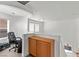 Hallway with wood floors and white walls, features a railing overlooking the lower level and a desk area at 8059 Wards Ferry St, Las Vegas, NV 89139