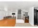 Bright living room featuring hardwood floors, neutral walls, and staircase leading to the second floor at 8059 Wards Ferry St, Las Vegas, NV 89139