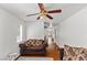 Comfortable living room with a ceiling fan, natural light, and a clear view of other rooms at 8059 Wards Ferry St, Las Vegas, NV 89139