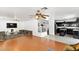 Open-concept living room and kitchen with hardwood floors and modern appliances at 8059 Wards Ferry St, Las Vegas, NV 89139