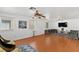 Spacious living room with hardwood floors, natural light, and comfortable seating arrangement at 8059 Wards Ferry St, Las Vegas, NV 89139