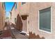A narrow side yard showing a walkway leading to the back of the house at 8059 Wards Ferry St, Las Vegas, NV 89139