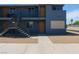 Two-story apartment building with a modern gray exterior, staircases and balconies, and a well-maintained landscape at 841 A, Boulder City, NV 89005