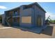 A modern gray two-story apartment building with clean lines, staircases, and balconies at 841 A, Boulder City, NV 89005