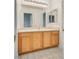 Bathroom featuring a large vanity with an expansive mirror at 8824 Charm Canyon Ave, Las Vegas, NV 89178