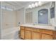 Bathroom showcasing a tub and vanity area with large mirror at 8824 Charm Canyon Ave, Las Vegas, NV 89178