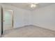 Bright bedroom features a ceiling fan and neutral carpet at 8824 Charm Canyon Ave, Las Vegas, NV 89178