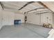Spacious garage with high ceilings, ample room for parking, and storage for tools and equipment at 8824 Charm Canyon Ave, Las Vegas, NV 89178